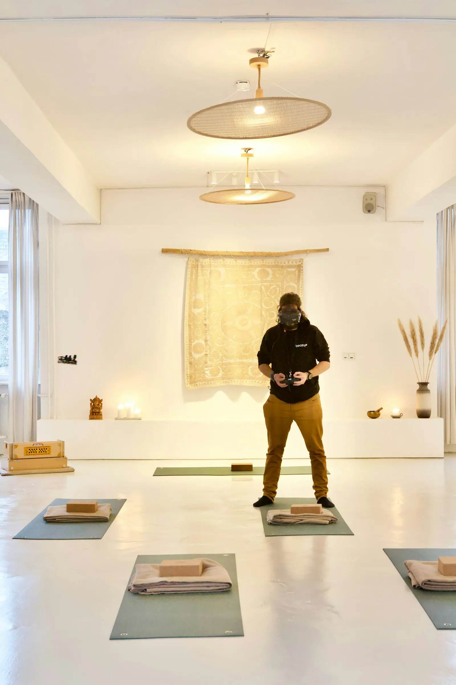 A person on a mat mid-practice in a bright room, focused and at ease